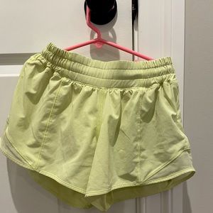 4 inch(long), size 2 yellow lululemon shorts.